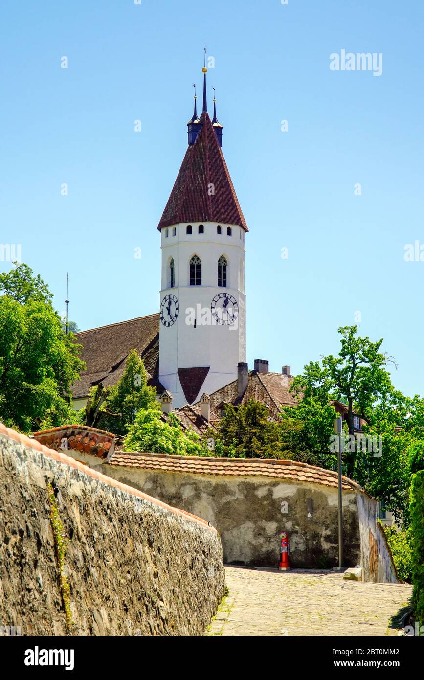 The impressive octagonal front tower of the Stadtkirche Thun dates back to around 1330. Thun, Bern canton, Switzerland. Stock Photo
