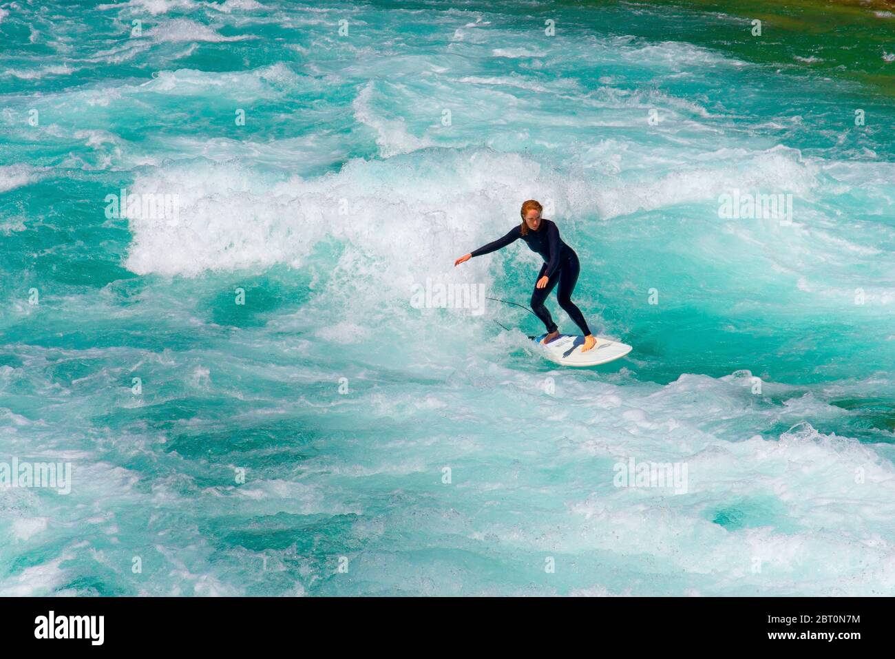 Surfing on the swift waves created when the sluice gates are open on Aarau  river in Thun city center, Bern canton, Switzerland Stock Photo - Alamy