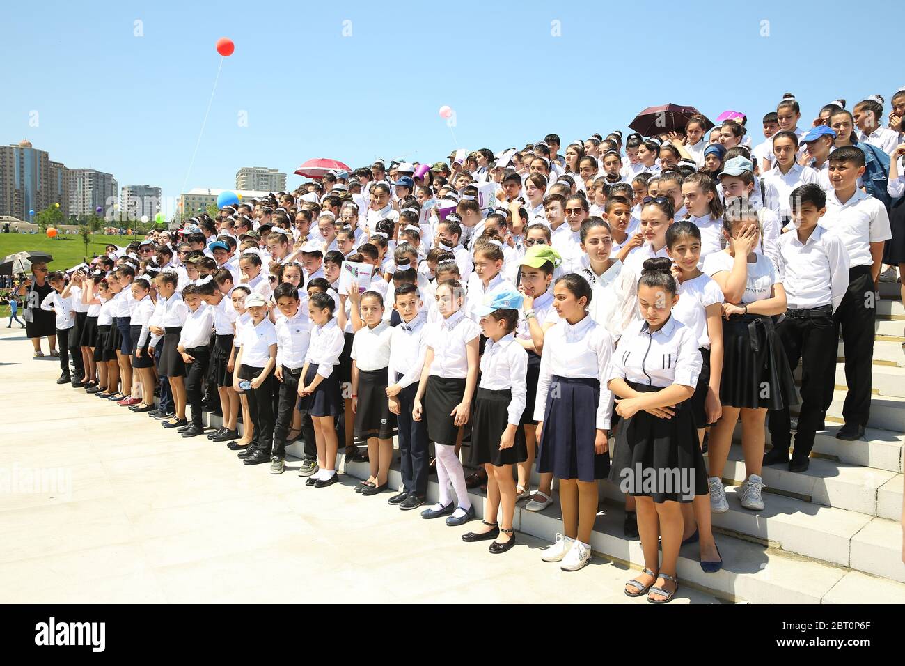 BAKU, AZERBAIJAN - JUNE 1 2019 : Kids festival . In park of Heydar Aliyev Center. They are preparing to read the National Anthem of Azerbaijan Stock Photo