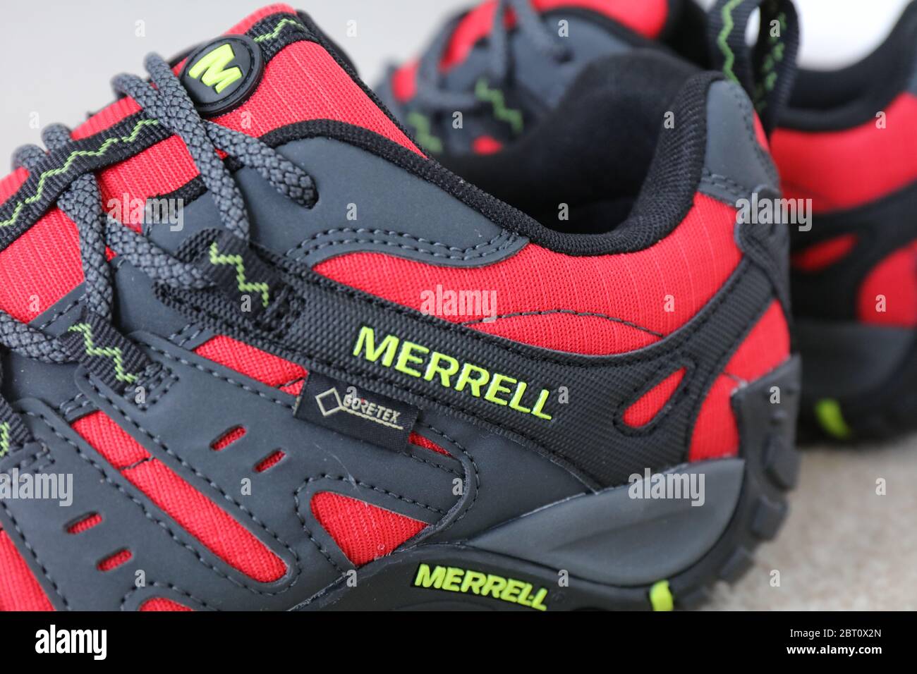 A Pair of a Merrell Red Accentor Sport GORE-TEX Trail Shoes Stock Photo -  Alamy