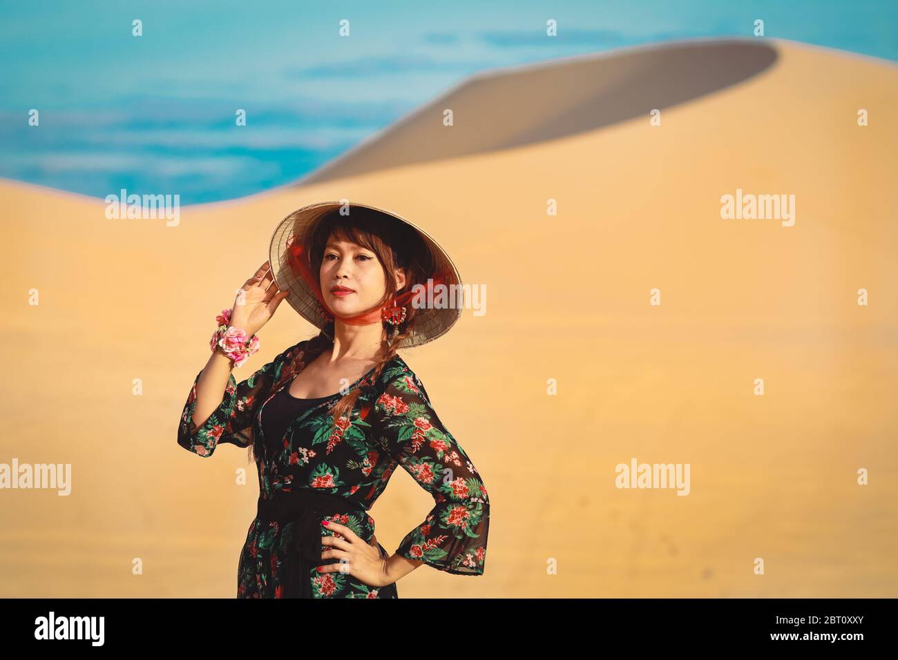 Beautiful asian woman enjoy her vacation on white sand dune in Mui ne, Vietnam Stock Photo