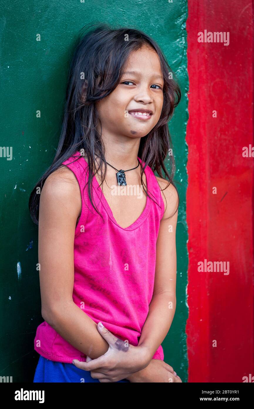 A pretty young Filipino girl poses and smiles for my camera in the old  walled city of Intramuros, Manila, The Philippines Stock Photo - Alamy
