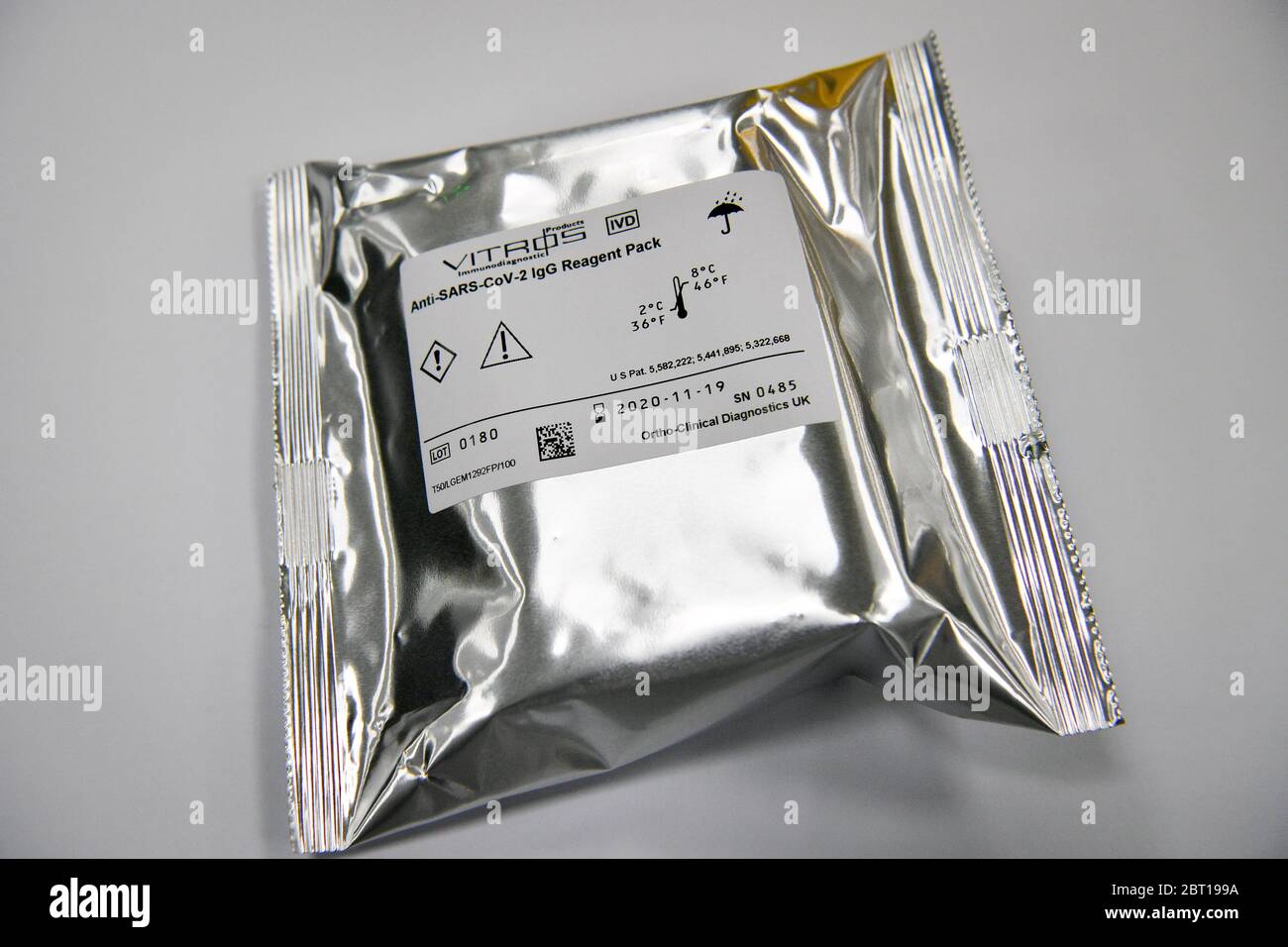 A covid-19 antibody testing kit at wrapped in sealed foil comes off the production line at the Ortho Clinical Diagnostics (OCD) testing laboratory in Pencoed in Wales. Stock Photo