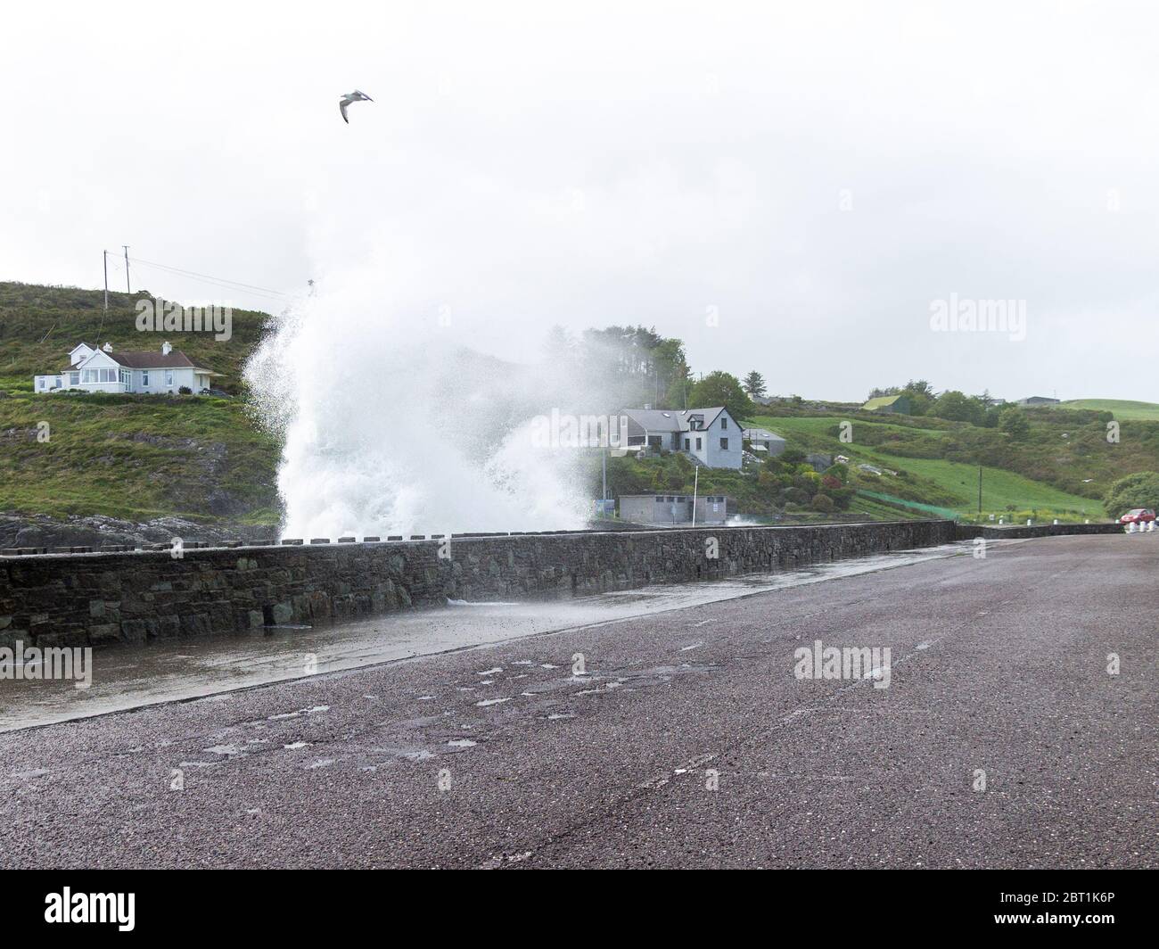 Storm waves breaking over a sea defence. Tragumna, West Cork, Ireland Stock Photo