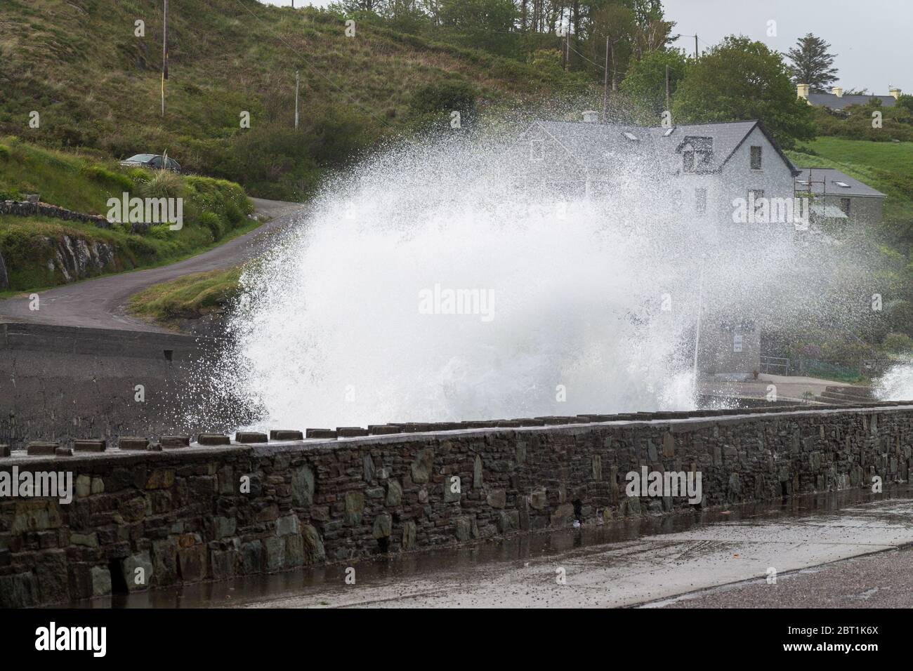 Storm waves breaking over a sea defence. Tragumna, West Cork, Ireland Stock Photo