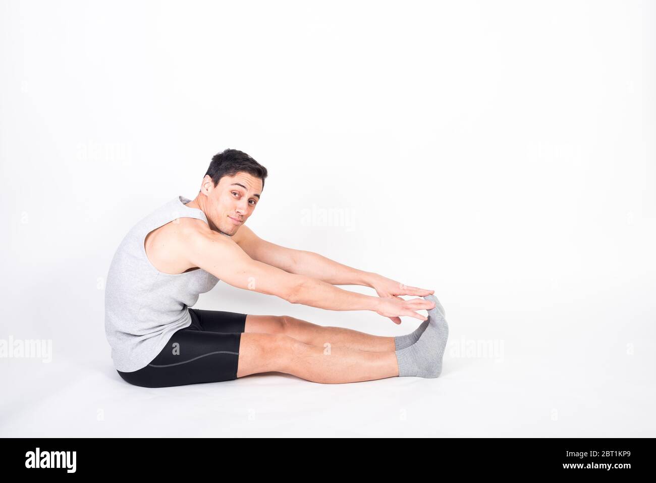 Stretching man in sportswear hi-res stock photography and images - Alamy
