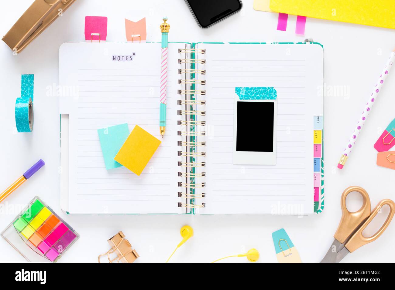 Colorful and fun office desk accessories in a white background Stock
