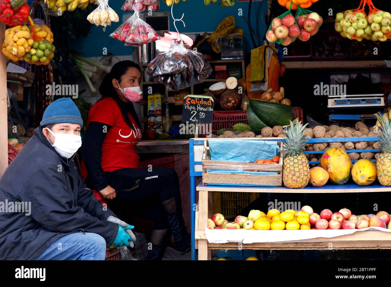 Lima, Peru. 21st May, 2020. Fruit and vegetables vendors attend at a street during the ongoing COVID-19 lockdown in Surco neighborhood Credit: Mariana Bazo/ZUMA Wire/Alamy Live News Stock Photo