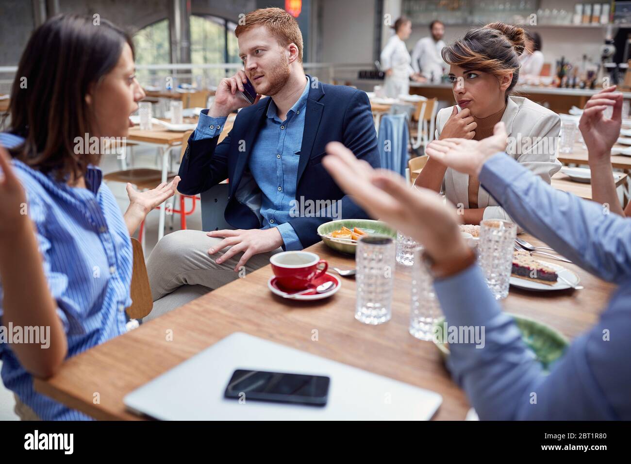 group of young caucasian people talking  at lunch. friends, colleagues, business partners concept Stock Photo