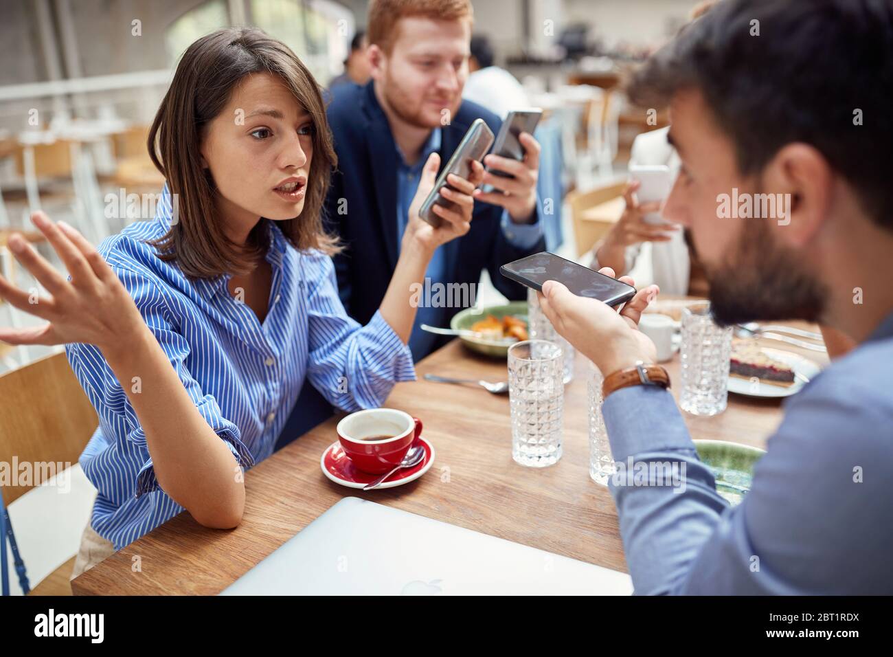 young businesswoman helplessly spreading hands, explaining, defending herself about bad business after corona virus. economy after covid 19 Stock Photo