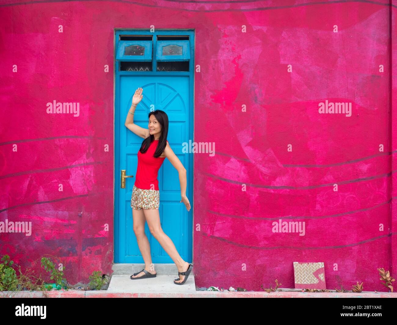 Portrait of a woman standing in a doorway, Maldives Stock Photo - Alamy