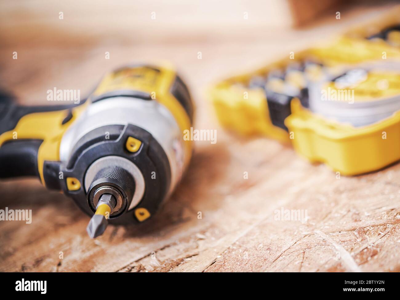 Close Up Of Cordless Black And Yellow Power Drill And Plastic Yellow