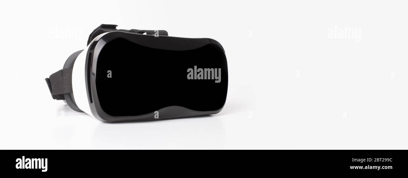 VR virtual reality glasses half turned on light gray background. Stock Photo