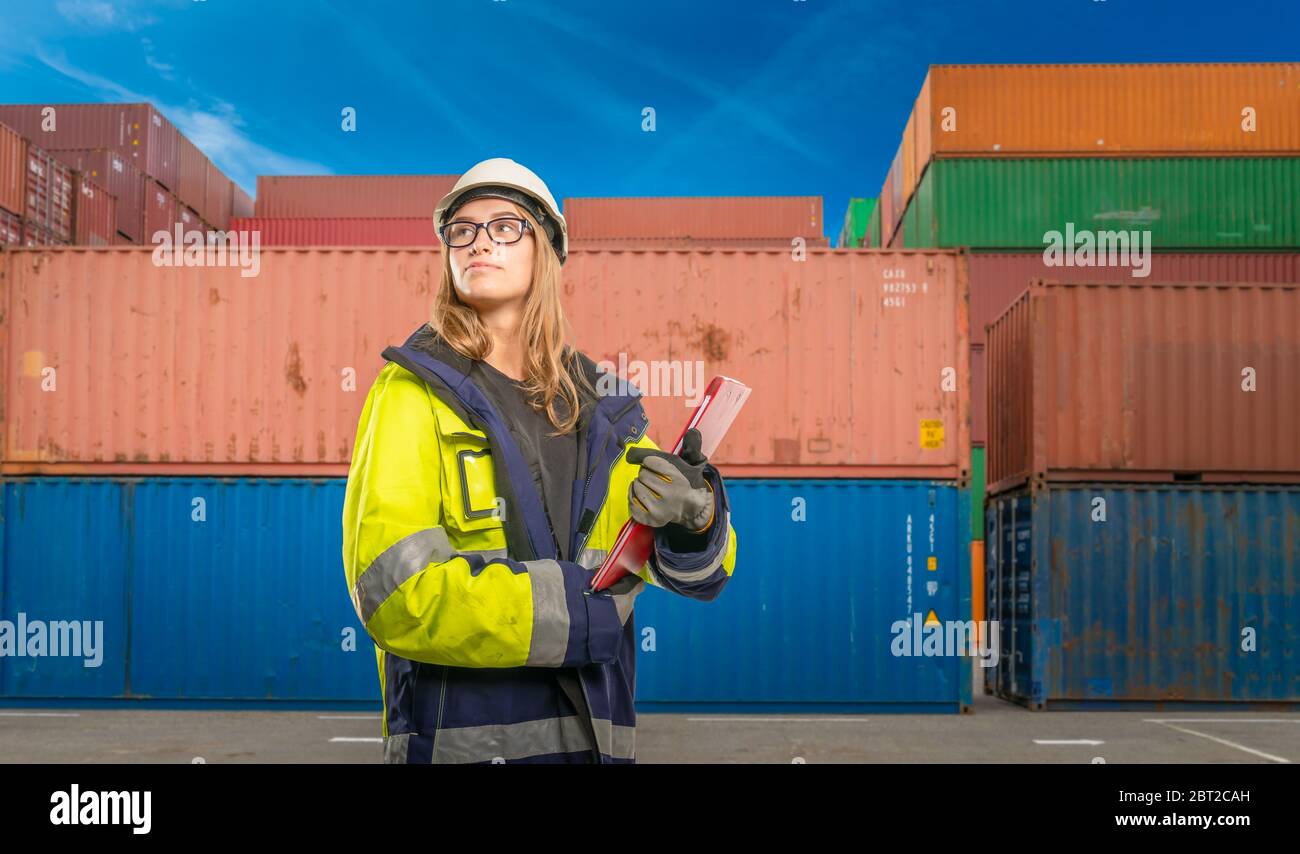 a female foreman in logistics as a dock worker Stock Photo