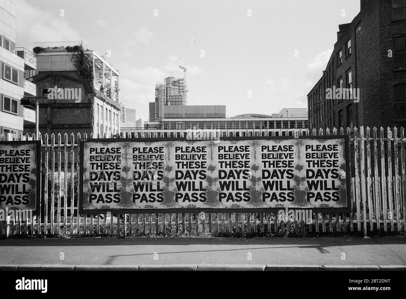Posters on a fence in Shoreditch, East London UK, during the coronavirus lockdown, May 2020 Stock Photo