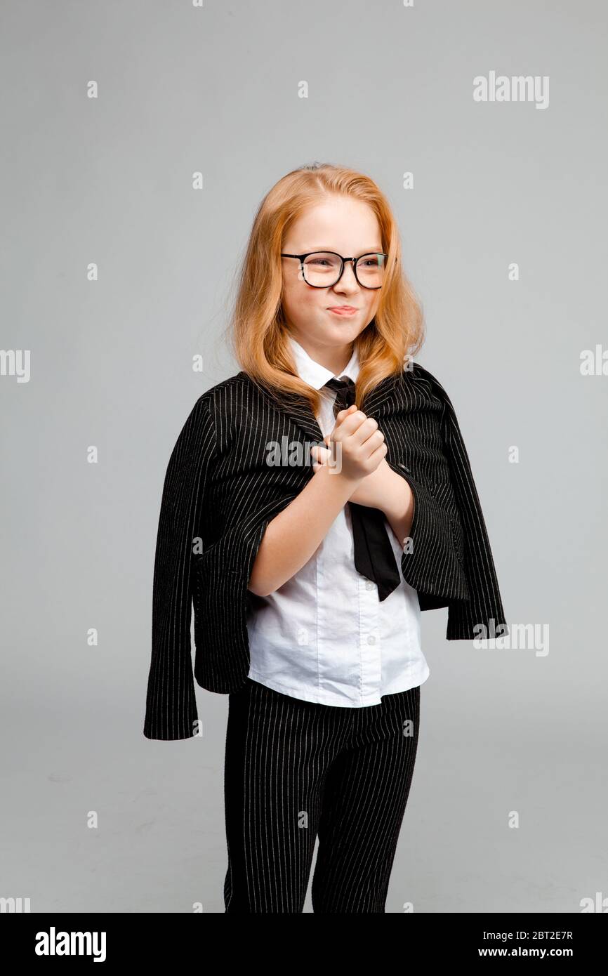 Cute red-haired girl in a business suit Stock Photo - Alamy