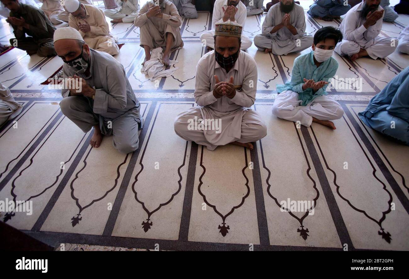 Faithful Muslims offer congregational Friday prayers with SOPs levels on government guidelines of social distancing as preventive measure against the spread of the Coronavirus (COVID-19) during the Holy month of Ramadan-ul- Mubarak, held at Sunehri Masjid in Peshawar on Friday, May 22, 2020. Stock Photo