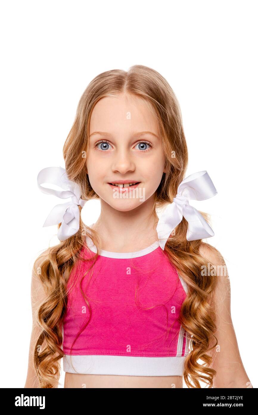 long-haired girl in a pink tank top smiles Stock Photo - Alamy