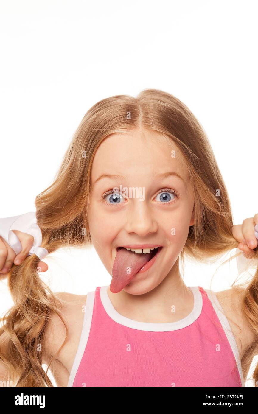 Cute Girl Makes Funny Faces And Smiles Photo With A White Background Stock Photo Alamy