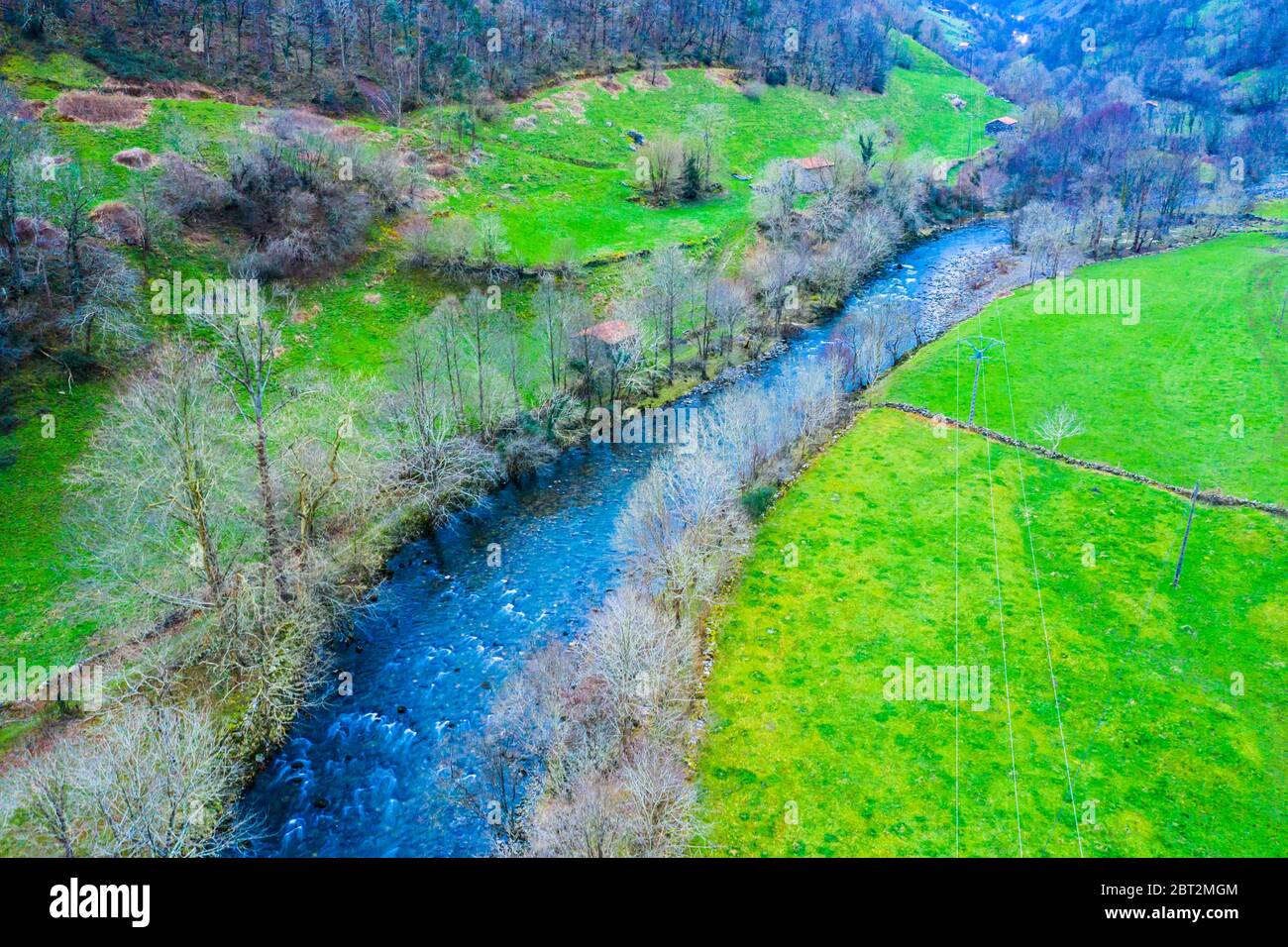 Riverbed and pasture aerial view. Stock Photo