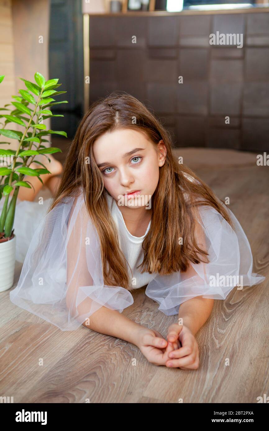 calm young 11 years old girl lies on the floor Stock Photo Alamy