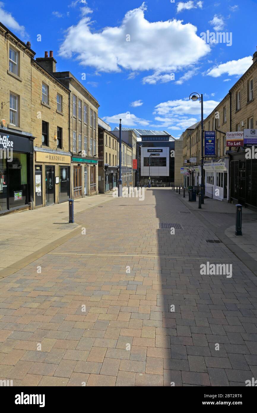 Closed shops and bars on deserted King Street during the Coronavirus pandemic, Huddersfield, West Yorkshire, England, UK. Stock Photo