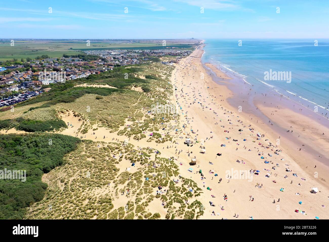 worlds most beautiful beaches, camber sands on a beautiful sunny day packed with beach lovers Stock Photo