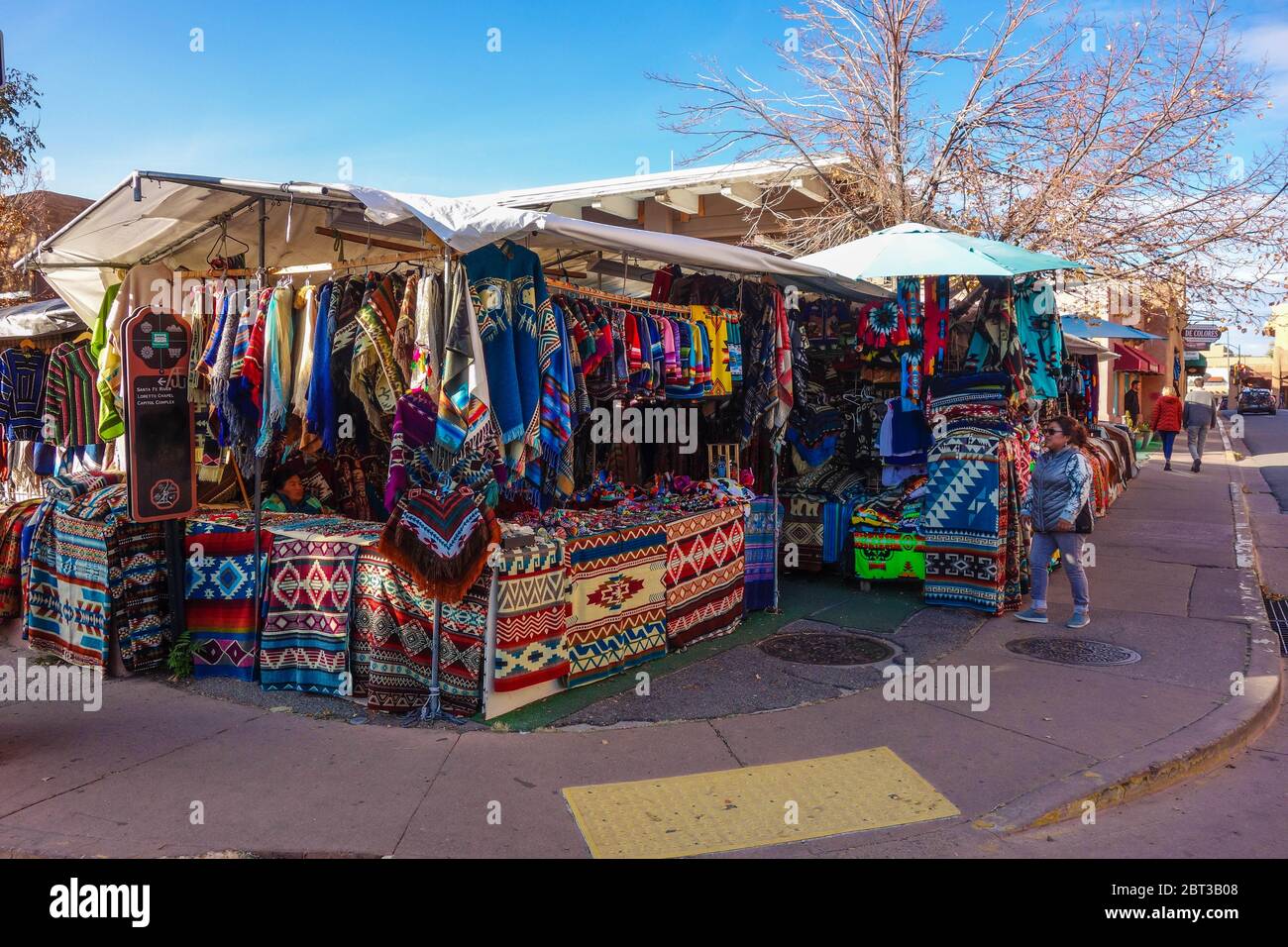 Rugs on display in market in Santa Fe, NM Stock Photo