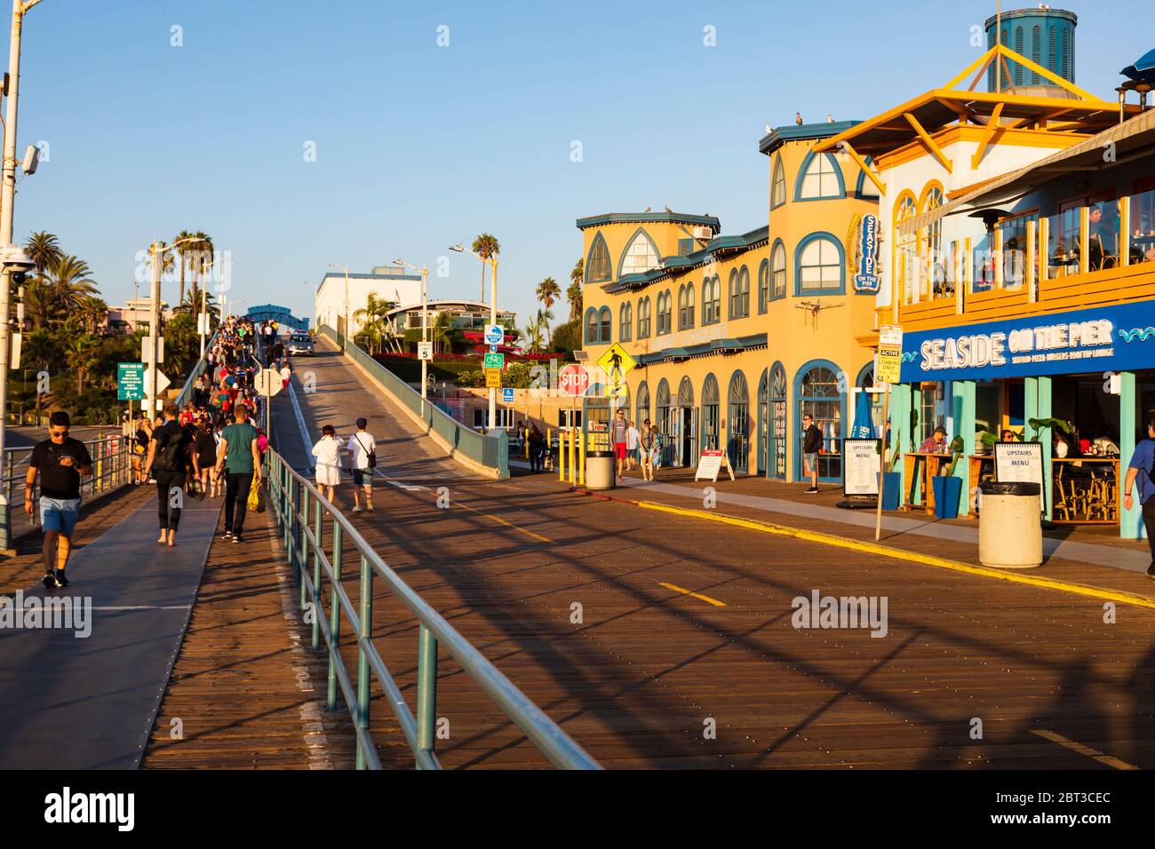 Crowds of tourists on Santa Monica pier at sundown, Los Angeles, California, United States of America. Stock Photo