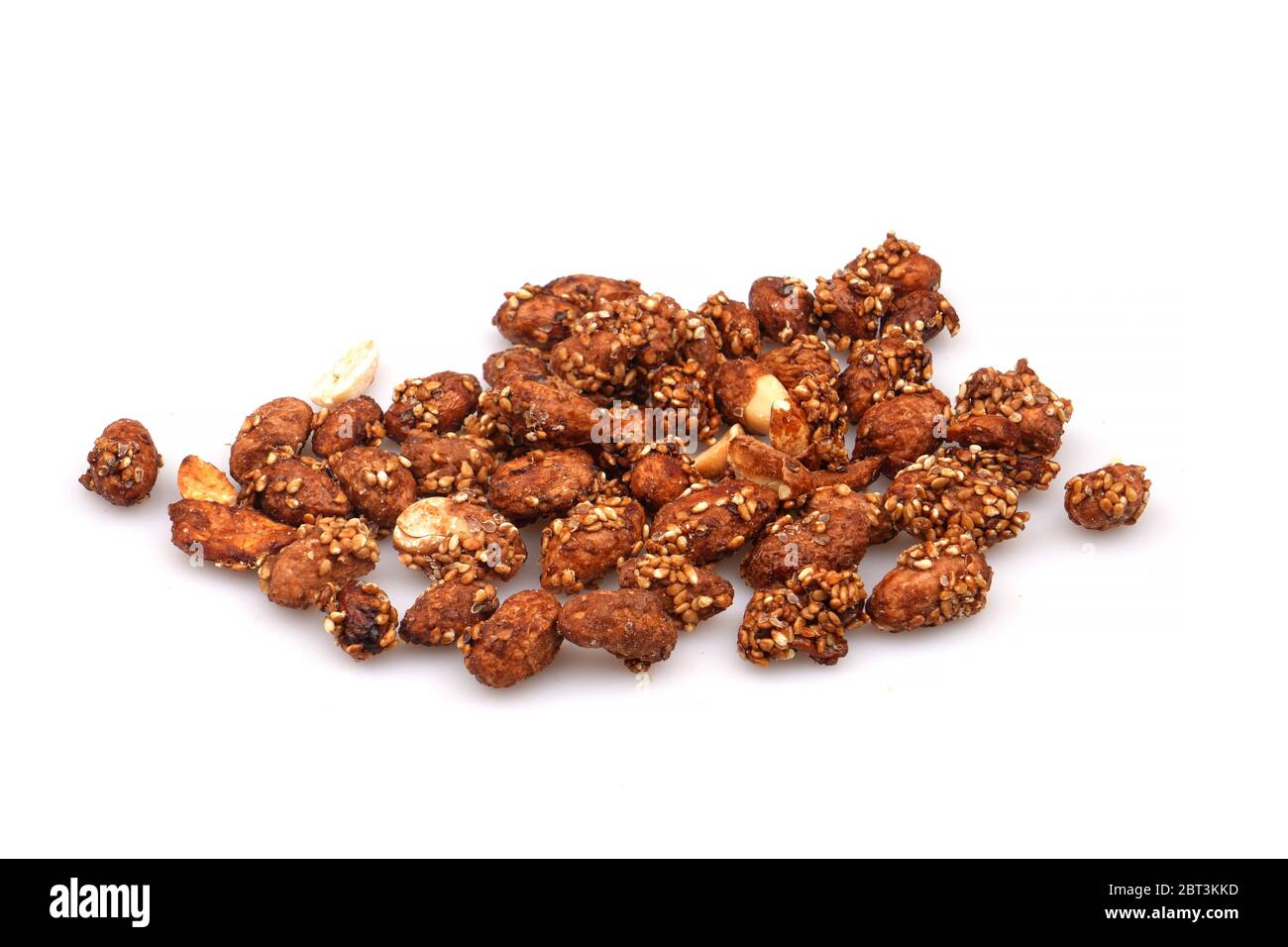 A Group Organic sauce covered peanuts on a white background Stock Photo