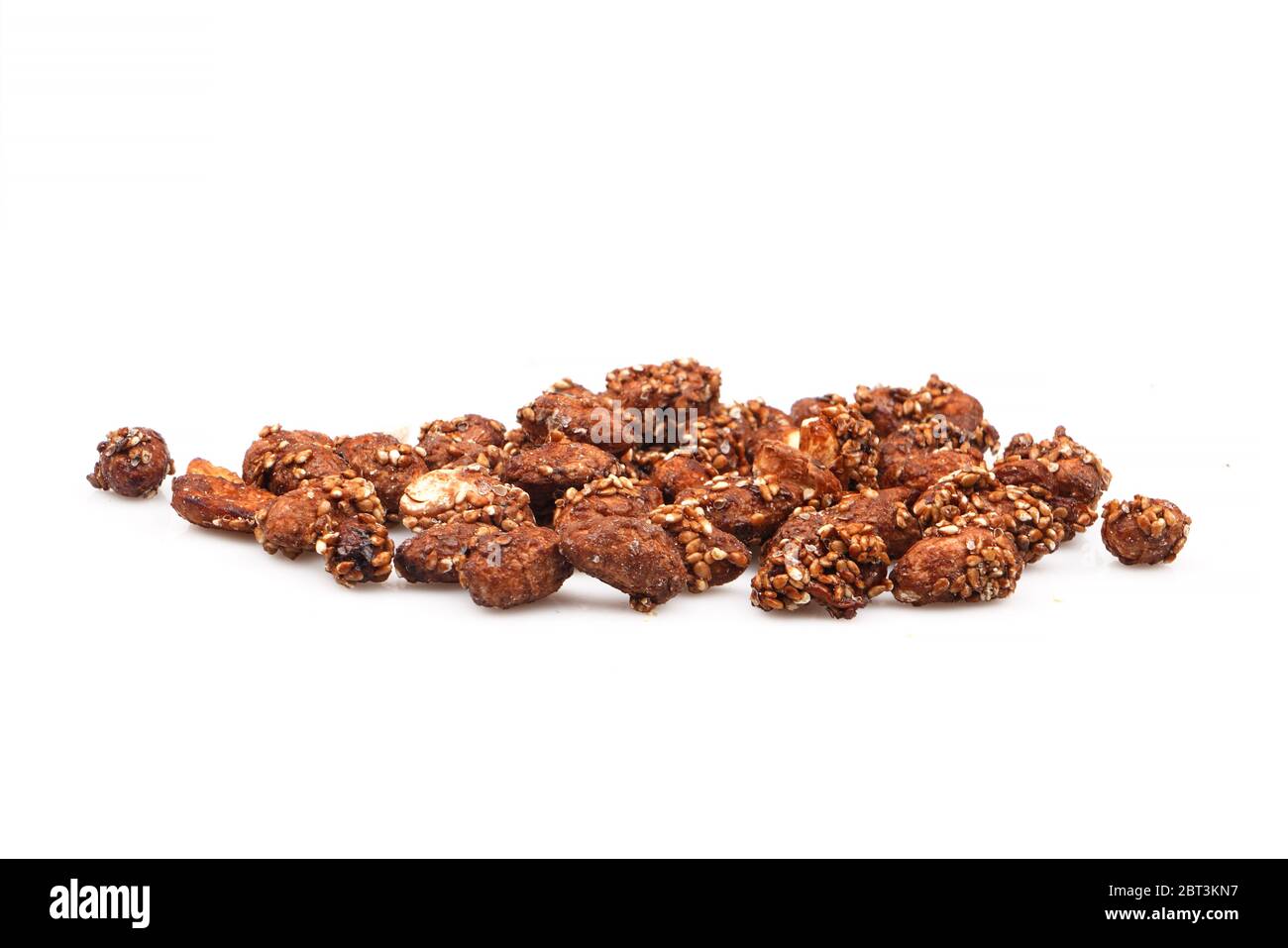 Organic sauce covered peanuts on white background Stock Photo