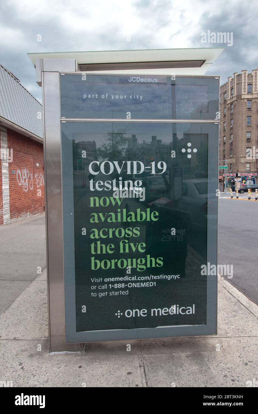 sign at a bus stop  advertising that covid-19 or coronavirus testing is available across the five boroughs during the pandemic Stock Photo