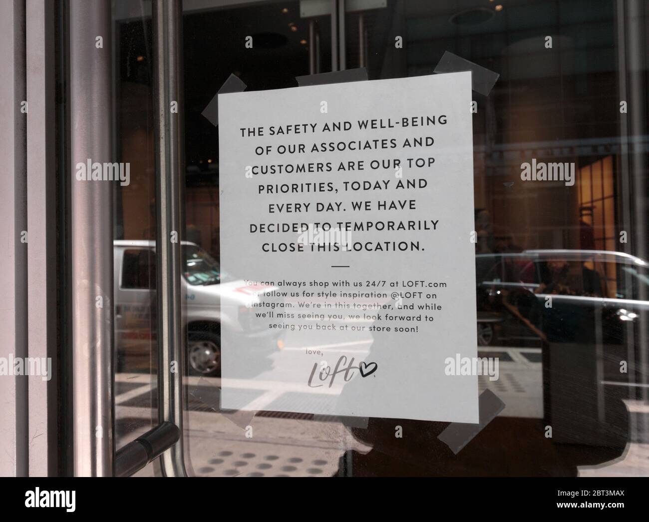 sign at a Loft store in midtown Manhattan stating it is closed due to the coronavirus or covid-19 pandemic Stock Photo