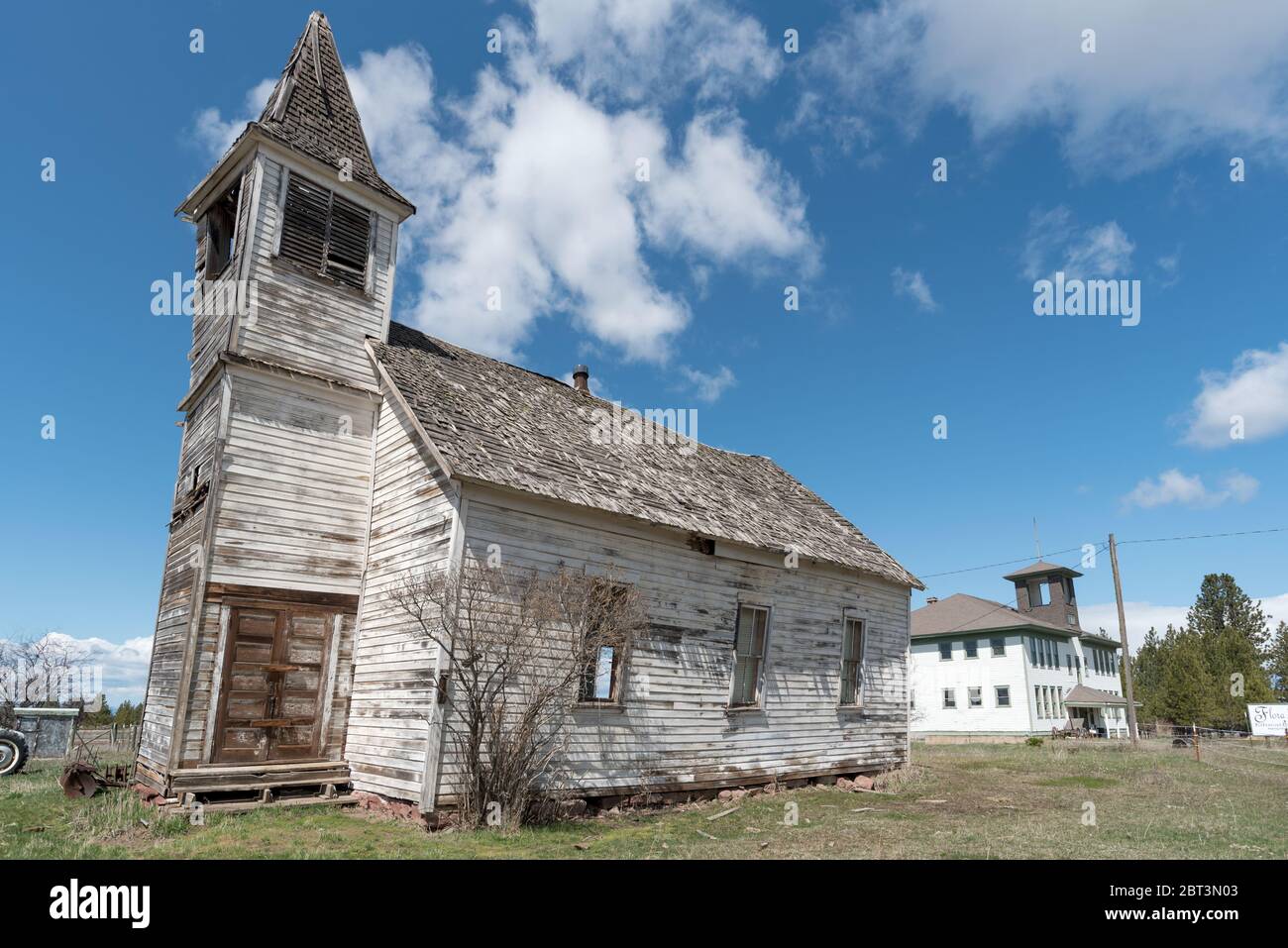 Old leaning church and school in the ghost town of Flora, Oregon Stock Photo