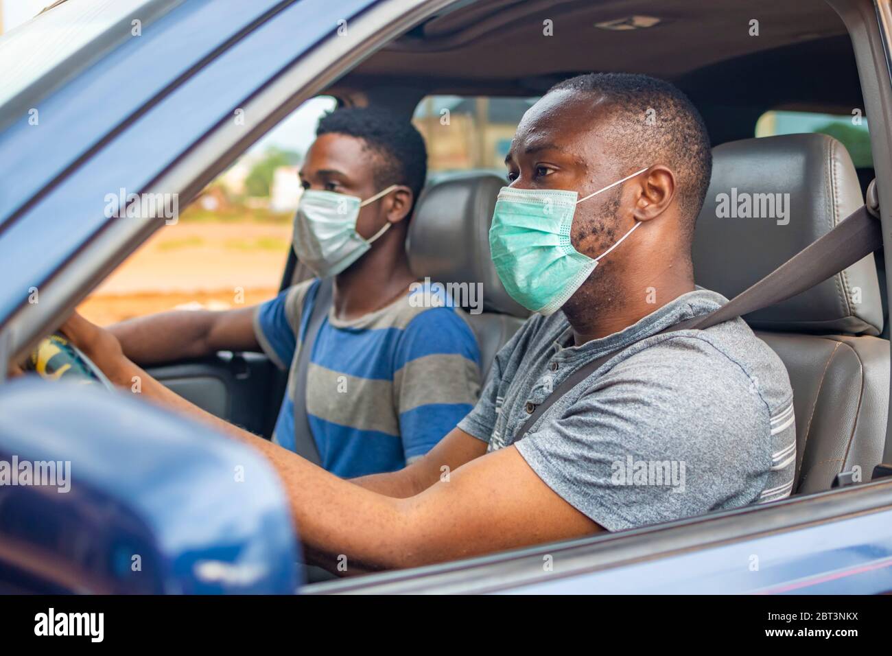 Black men wearing masks hi-res stock photography and images - Alamy