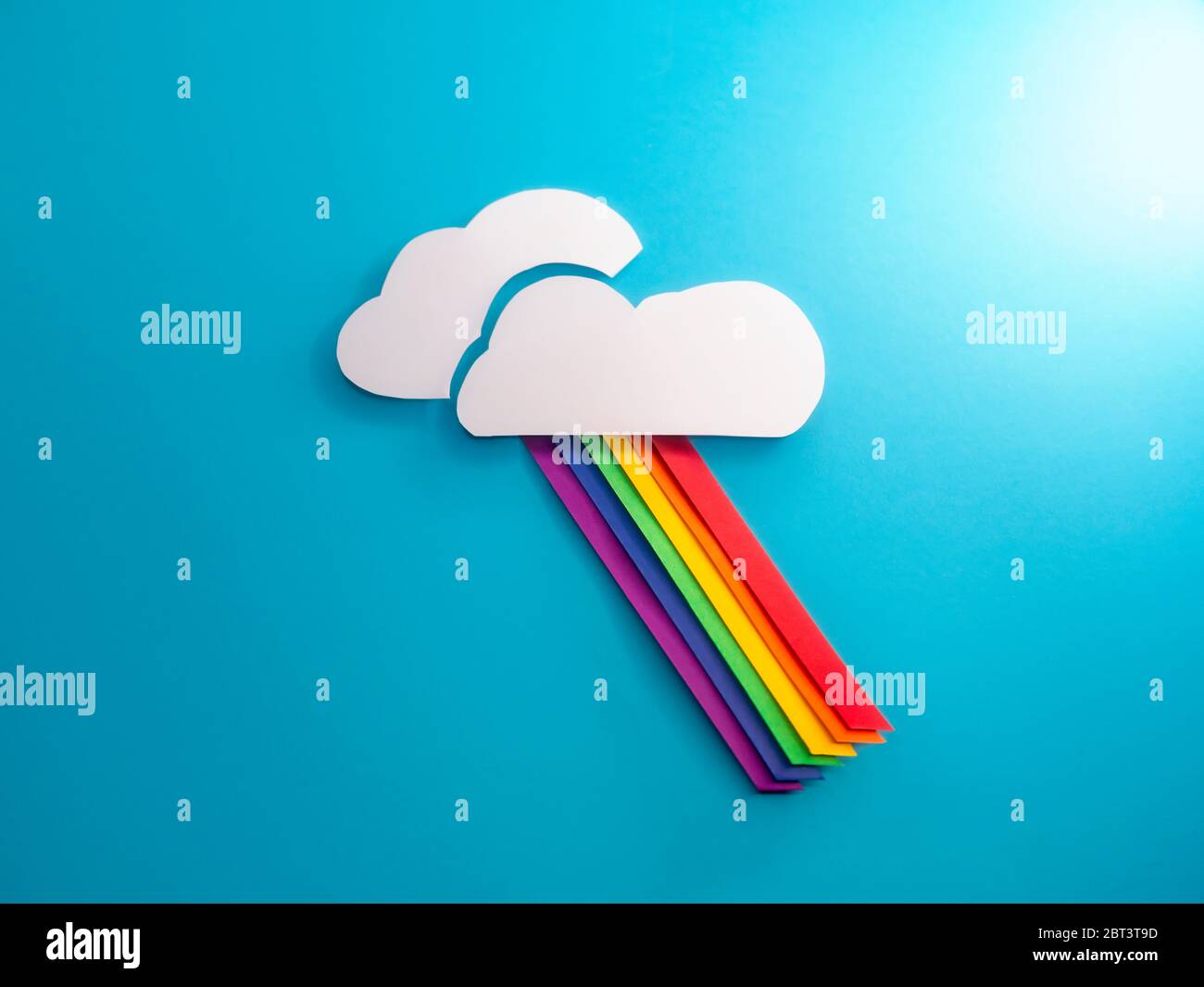 Conceptual rainbow through the clouds Stock Photo