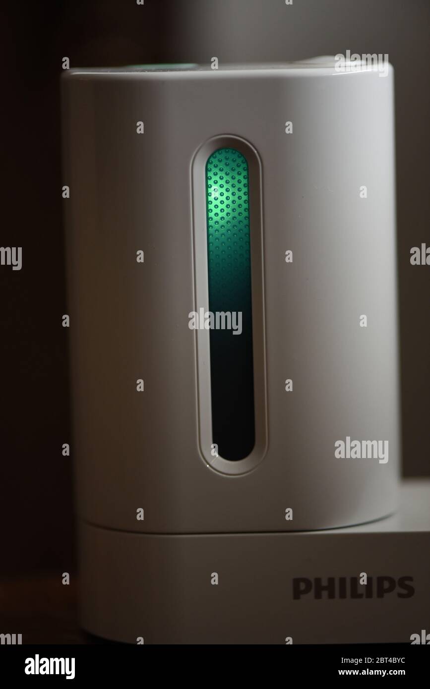 Exterior view of a Philips Sonicare toothbrush UV Sanitizer in action with  door closed and ultraviolet light on. The company claims the technology hel  Stock Photo - Alamy