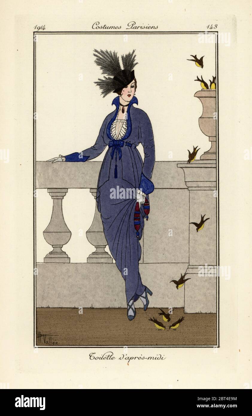 Woman in afternoon dress and hat watching birds. Toilette dapres-midi. Handcoloured pochoir (stencil) etching after an illustration by Armand Vallee from Tommaso Antonginis Journal des Dames et des Modes, Aux Bureaux du Journal des Dames, Paris, 1914. Stock Photo