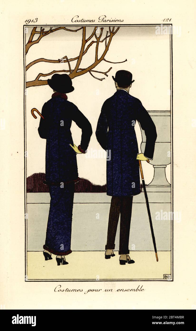 Man and woman in fashionable suits, 1913. Costumes pour un ensemble. Handcoloured pochoir (stencil) etching after an illustration by Bernard Boutet de Monvel from Tommaso Antonginis Journal des Dames et des Modes, Aux Bureaux du Journal des Dames, Paris, 1913. Stock Photo