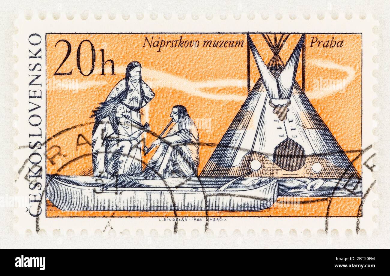 SEATTLE WASHINGTON - May 2, 2020:  Czechoslovakia stamp with Native Americans, canoe and tepee of the National Naprstek Museum of Prague. Scott # 1400 Stock Photo