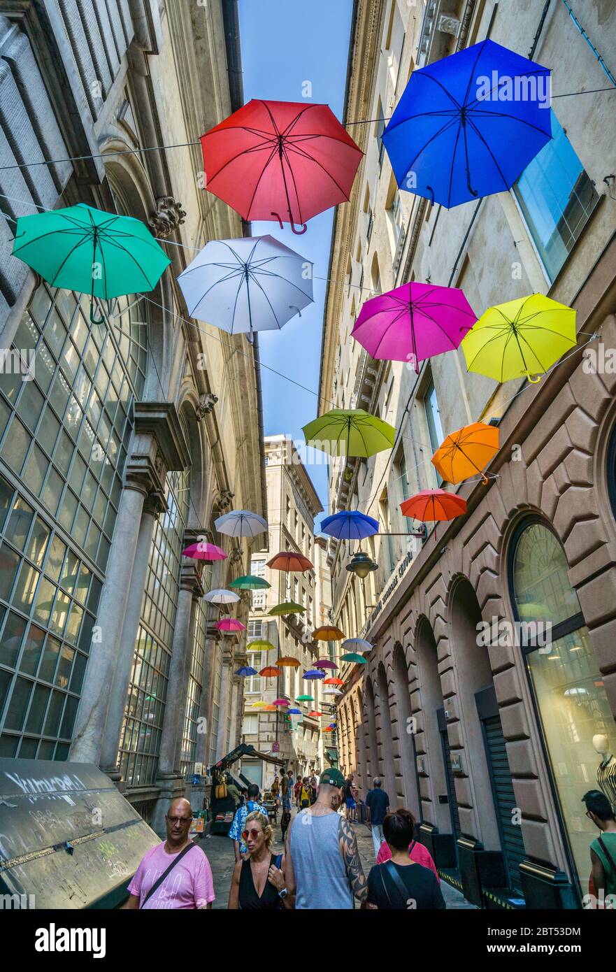 umbrellas suspended in Via Banchi in the historic city center of Genoa, Liguria, Italy Stock Photo