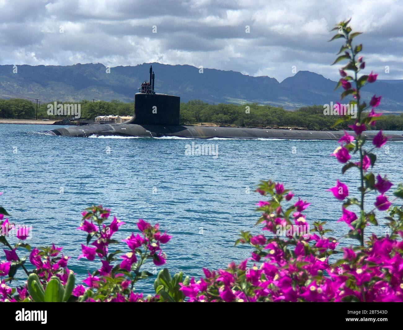 PEARL HARBOR, Hawaii (May 10, 2020) – USS Missouri (SSN 780), a Virginia-class fast-attack submarine, departs Pearl Harbor after completing a scheduled extended dry-docking selected restricted availability (EDSRA). Missouri's routine maintenance and modernization work was completed five days ahead of schedule after successful sea trials and certification. The submarine's recent availability required 2.2 million work-hours to complete more than 20,000 jobs that will ensure the ship remains fully operational for its planned 33-year service life. Stock Photo