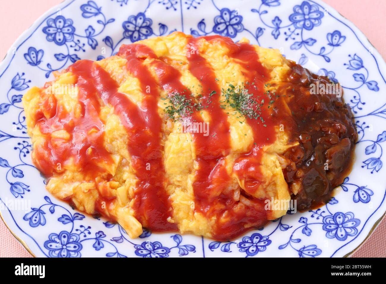 Japanese food, Omuraise with ketchup in a plate on table Stock Photo