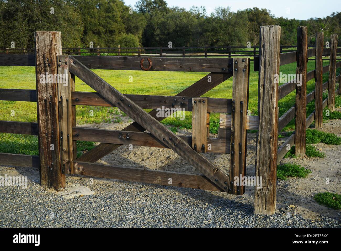 Wooden corral gate with horseshoe for good luck Stock Photo - Alamy