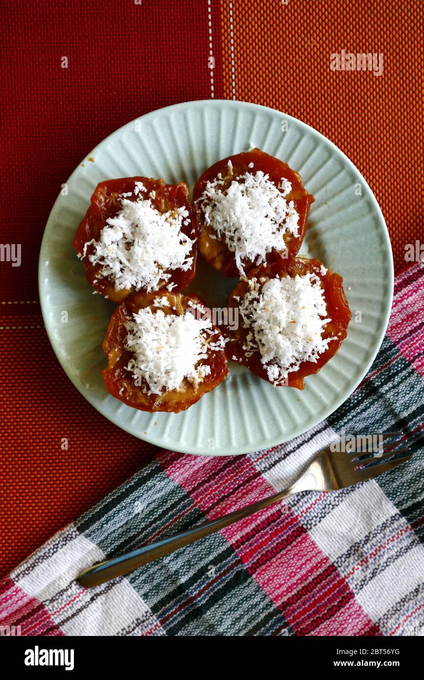 Photo of Filipino snack food called Kutsinta or glutenous rice cake with coconut shavings. Stock Photo