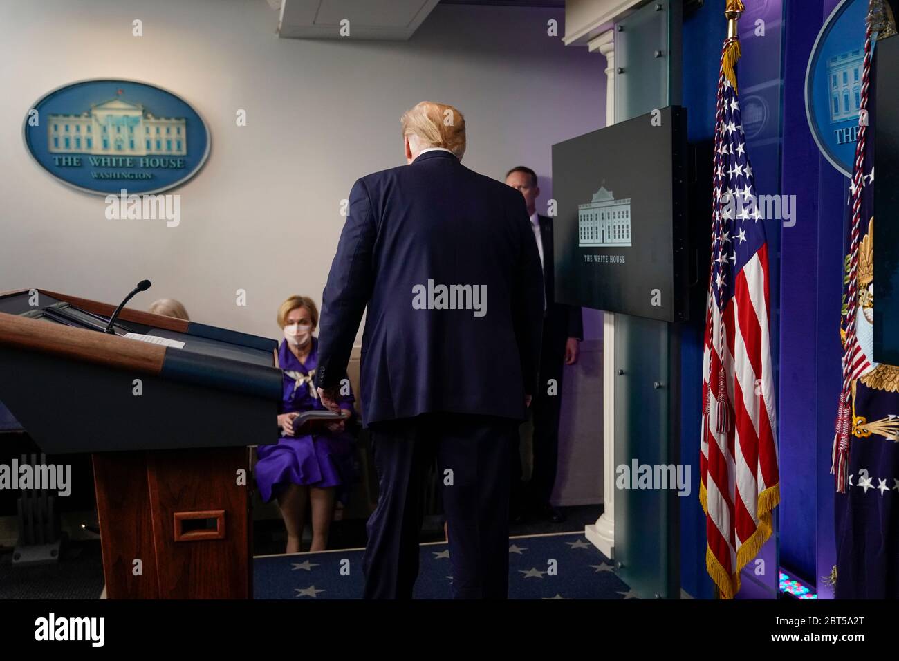 United States President Donald J. Trump leaves a news conference in the Brady Press Briefing Room of the White House in Washington, DC, U.S., on Friday, May 22, 2020. Trump didn't wear a face mask during most of his tour of Ford Motor Co.'s ventilator facility Thursday, defying the automaker's policies and seeking to portray an image of normalcy even as American coronavirus deaths approach 100,000. Credit: Andrew Harrer/Pool via CNP/MediaPunch Stock Photo