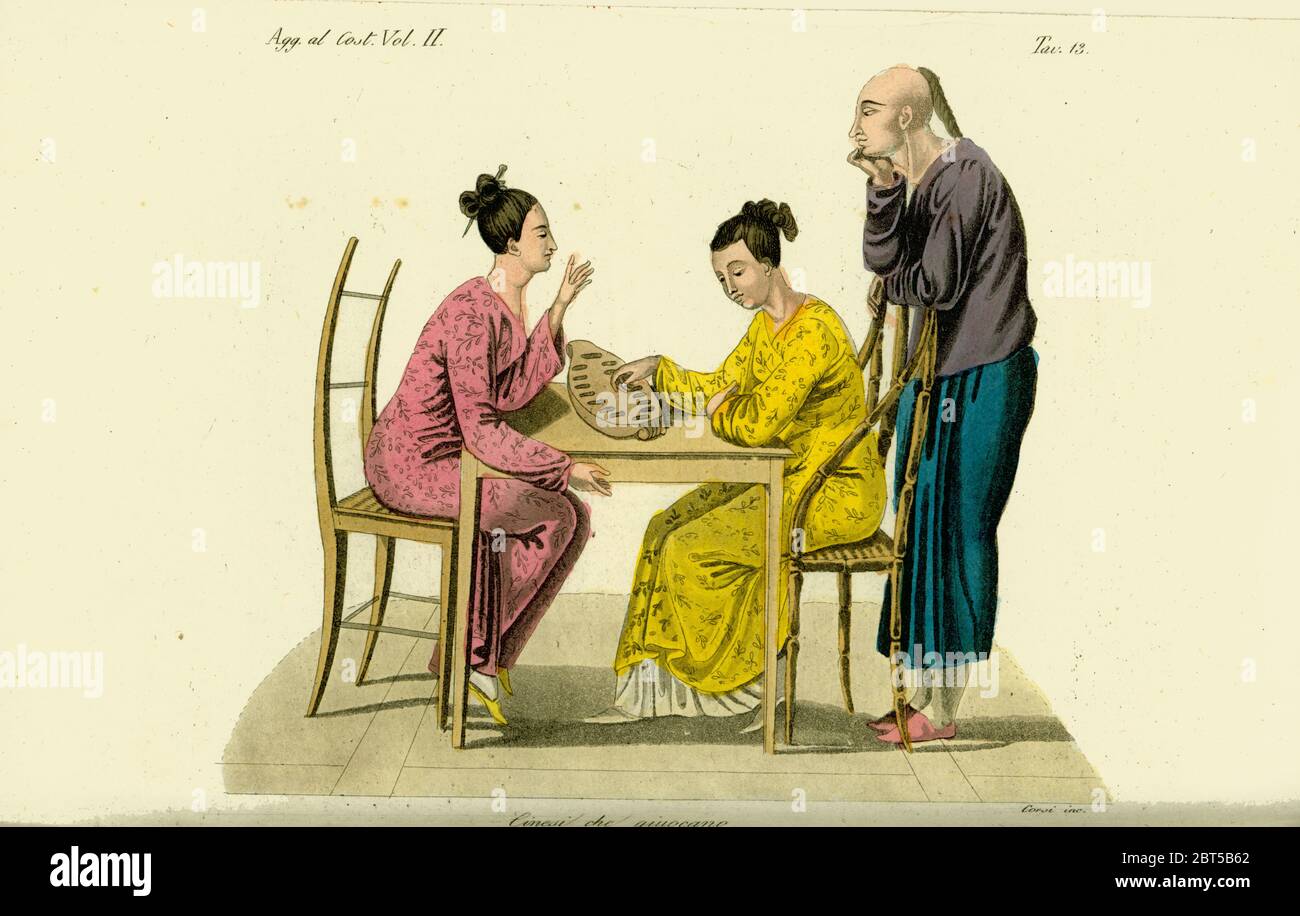 Two Chinese women playing the game of congkak or tchonka, Timor, 19th century. A Chinese man with pigtail watches. Handcoloured copperplate engraving by Corsi from Giulio Ferrario's Costumes Ancient and Modern of the Peoples of the World, Florence, 1834. Stock Photo