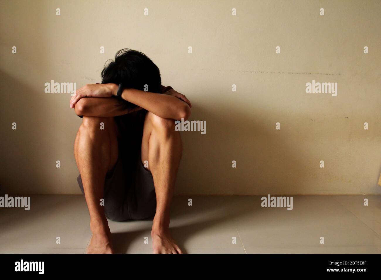 Sad Young Man Sitting Alone In A Empty Room Sad Lonely Chool Adolescence Home Violence Unwanted Love Problems Alone Family Stock Photo Alamy