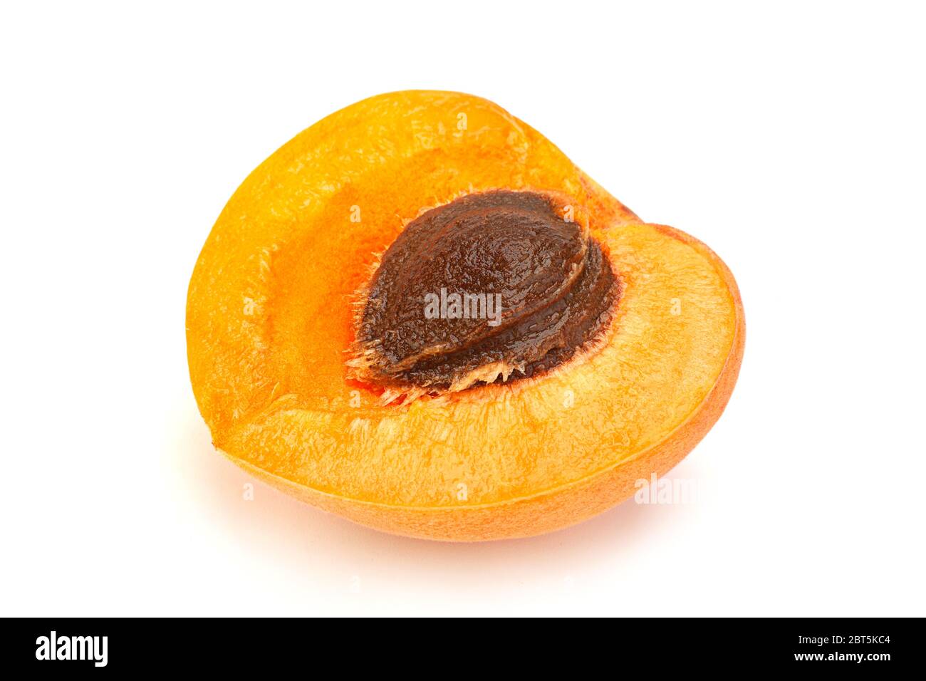 Apricot fruit closeup isolated on white background Stock Photo