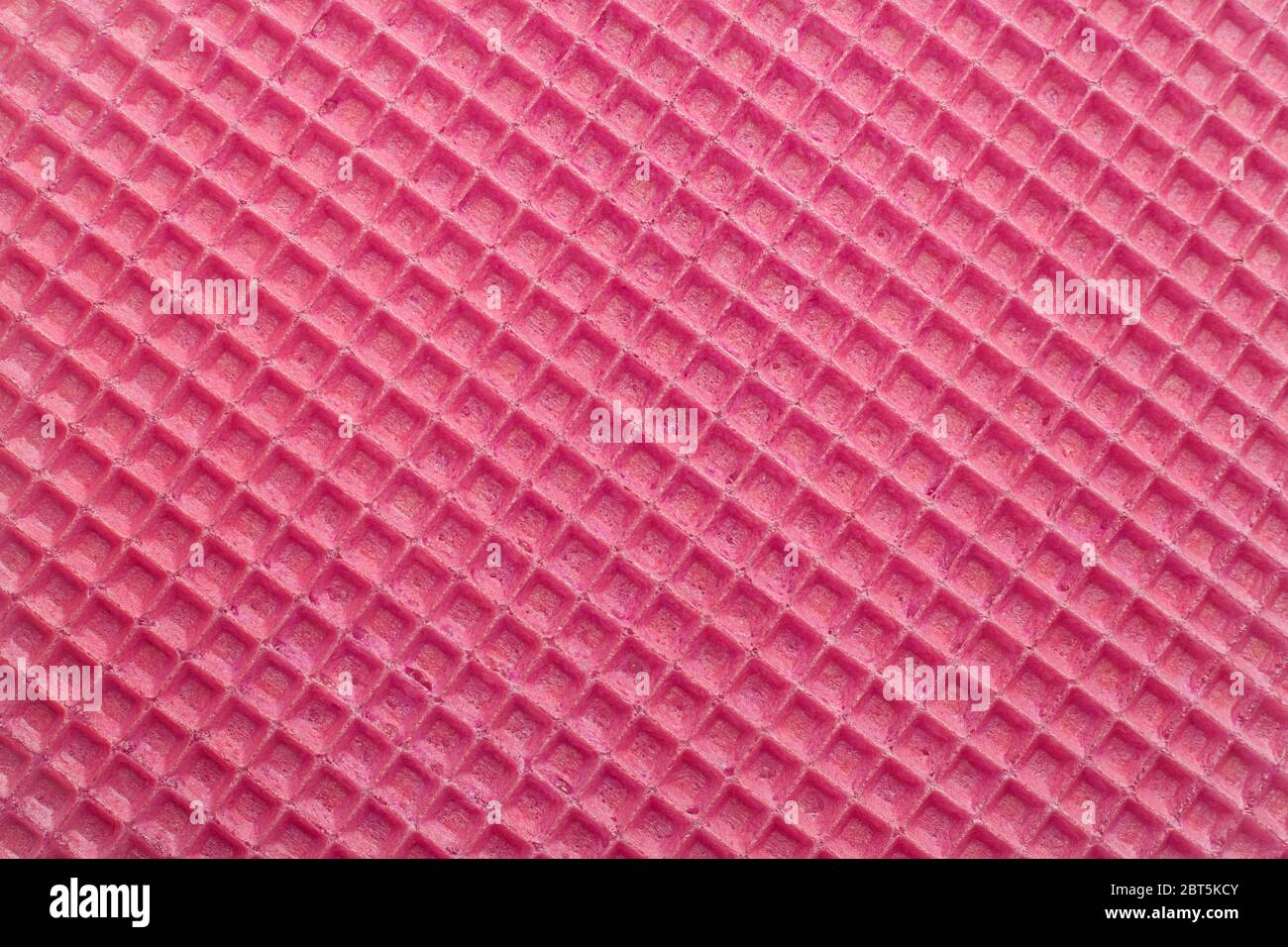 Red waffles surface closeup detail background Stock Photo